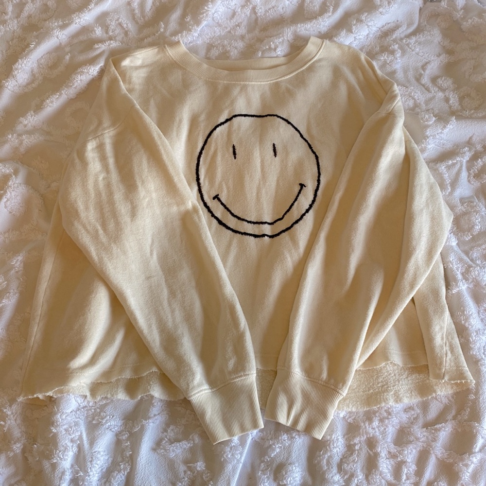 Cream Colored long sleeve with black smiley face